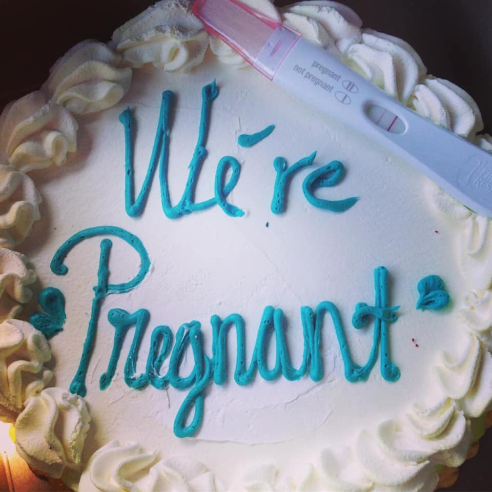 A woman has been slammed for using her positive pregnancy test as a cake topper to announce baby news