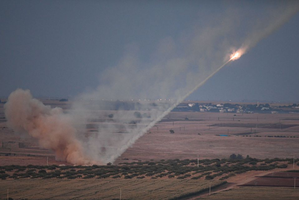  Turkish forces towards the Syrian town of Ras al-Ain, from the Turkish side of the border