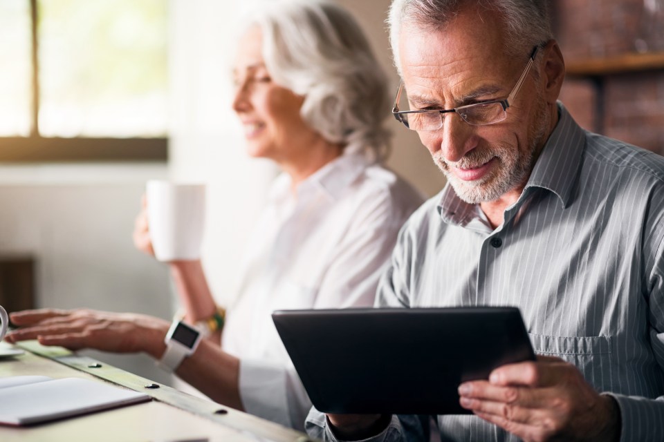 Retiree looking at iPad