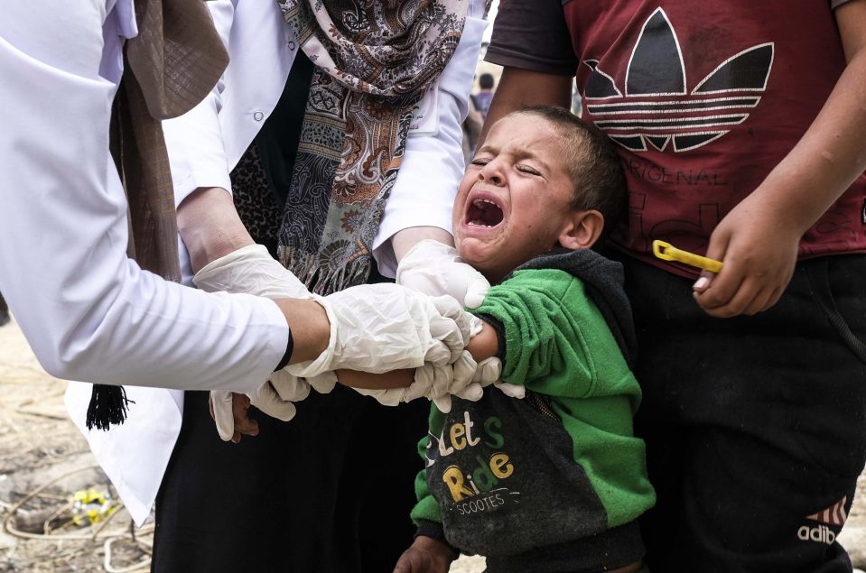 Syrian refugees children who fled the Turkish incursion in Northern Syria receive medicine 