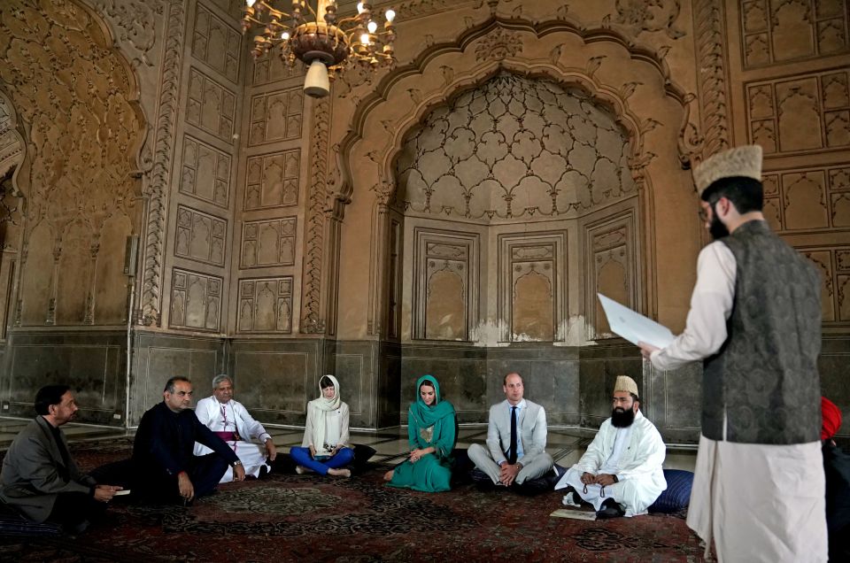  The couple were invited to sit down cross-legged after being introduced to a group of scholars and religious leaders, who were sitting on cushions, for a discussion on promoting interfaith harmony among communities