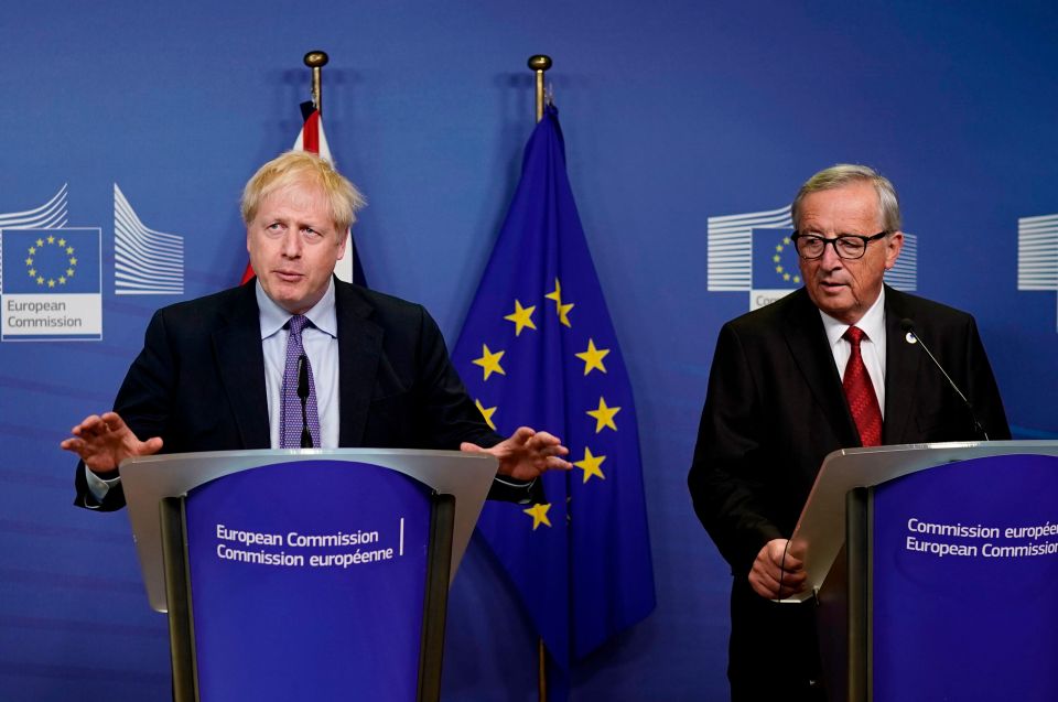  Boris Johnson and EU chief Jean Claude Juncker seal the Brexit deal in Brussels