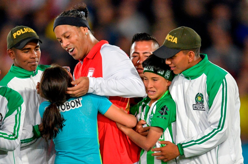 Even police had to drag young fans off the field