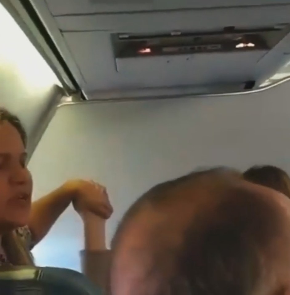 One woman could be seen reciting a prayer and holding two other passengers hands after the airplane pilot reported engine problems