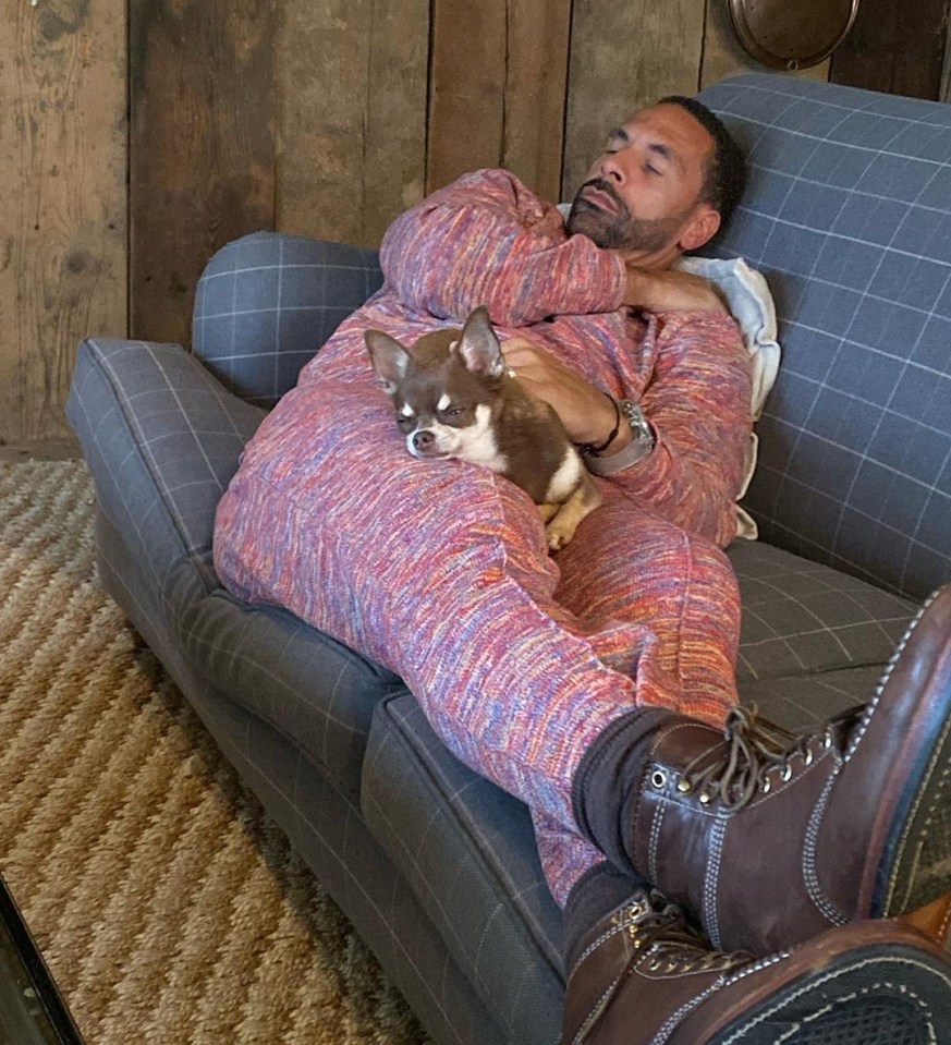  Rio Ferdinand is seen snuggled up in a onesie as his new wife renames their dog