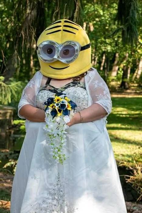  The bride stunned in a bright yellow minion mask as she walked down the aisle... that's a sentence we never thought we'd write