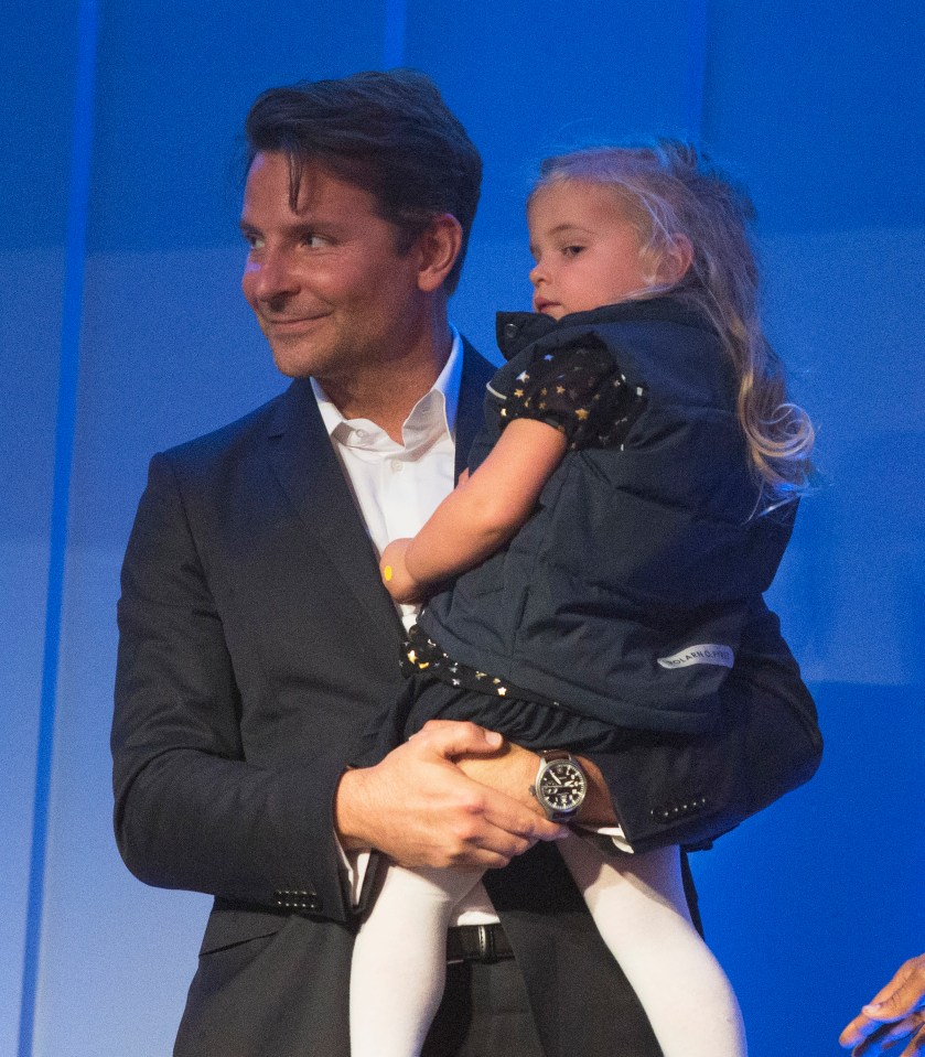  Bradley looked every inch the doting daddy at the event