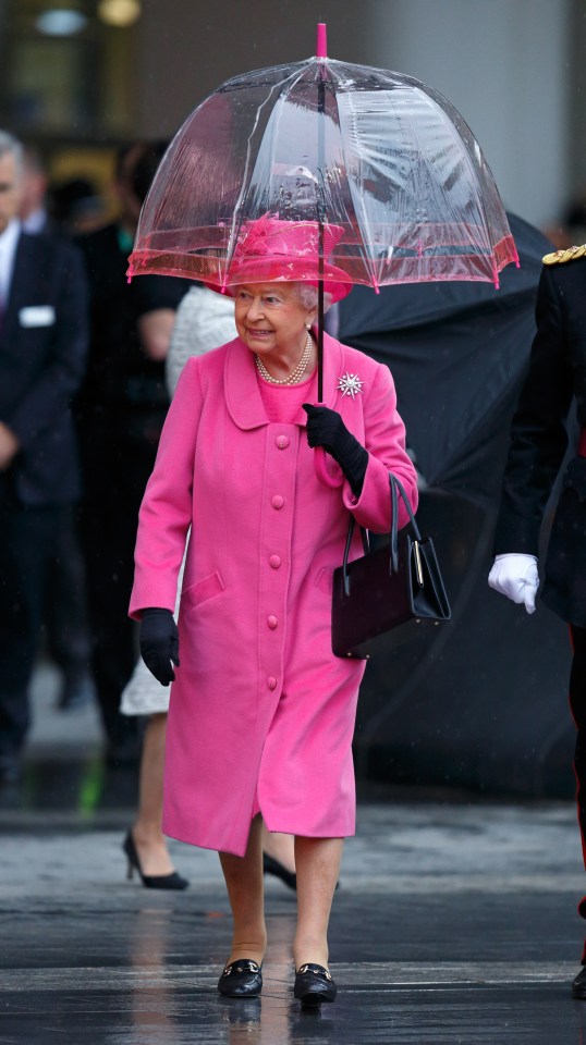  We all know Her Majesty is a fan of bright colours, but she also loves a good matching umbrella