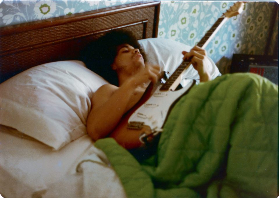  The pop icon relaxing in bed with a guitar at his home in Minnesota in 1978