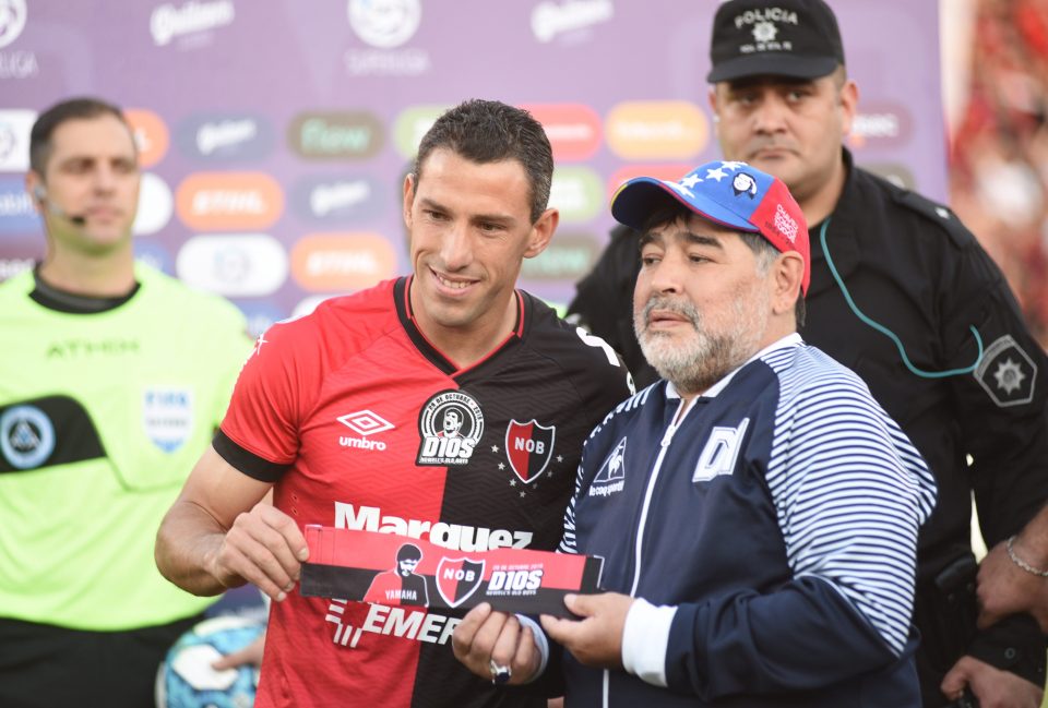  Former Liverpool player Maxi Rodriguez presented him with a banner