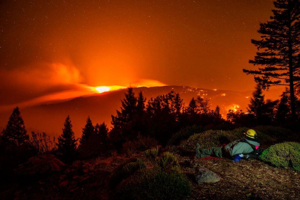  On fire watch... Alex DeLeon, 37, with Engine 342 of the Lake Tahoe Basin Management Unit of the US Forest Service watches the Kincade fire burn on a ridge between Lake and Sonoma Counties