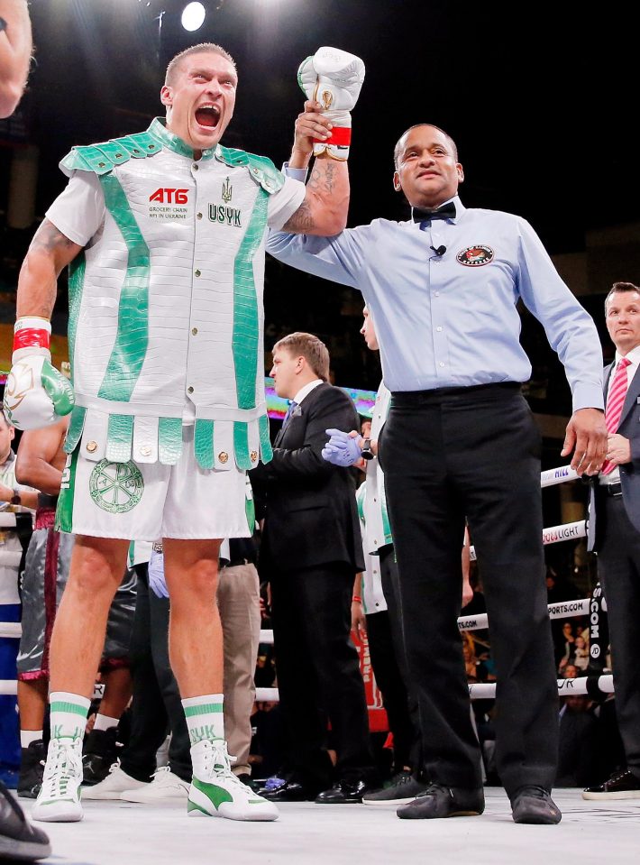  Oleksandr Usyk celebrates after winning on his heavyweight debut