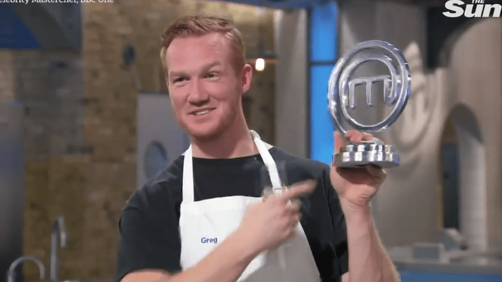  He proudly held his trophy aloft