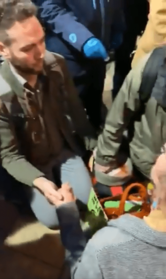  The protesters held hands next to the eco-friendly DLR train