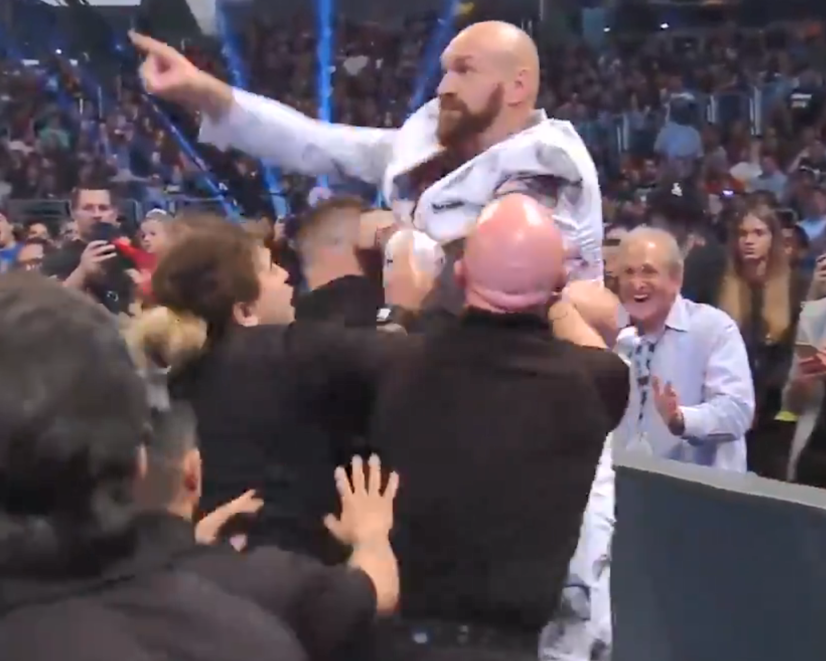  Tyson exploded with rage after being taunted by Strowman - leaping over the barrier to get his hands on him