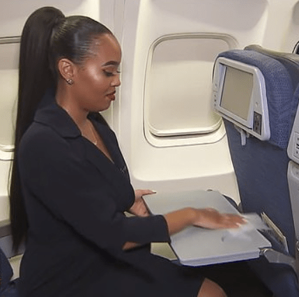 The former flight attendant demonstrates how to clean your surfaces as soon as you sit down