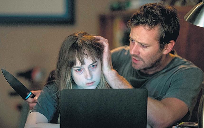  Dakota Johnson and Armie Hammer are both plagued by visions in the newest trailer