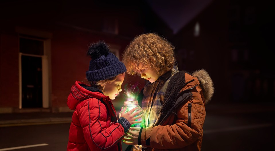 The little boy and girl use the magic to spread joy in their village