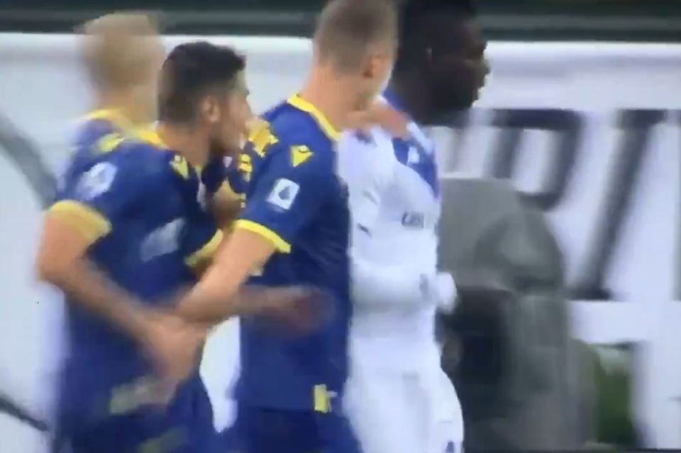  Verona players surrounded the striker after he kicked the ball