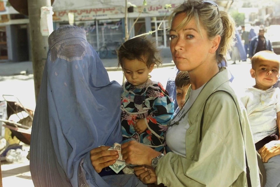  Writer Antonella Lazzeri helps a mum in Afghan capital Kabul, 2002