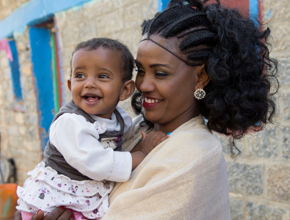  Birhan Woldu, who as a starving three-year-old in Ethiopia was shown in a video at the original Live Aid in 1985, is snapped with her daughter Ariam