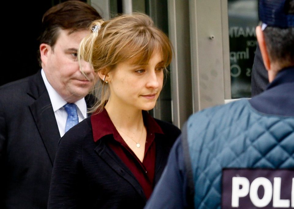  Smallville actress Mack, centre, pleaded guilty to racketeering