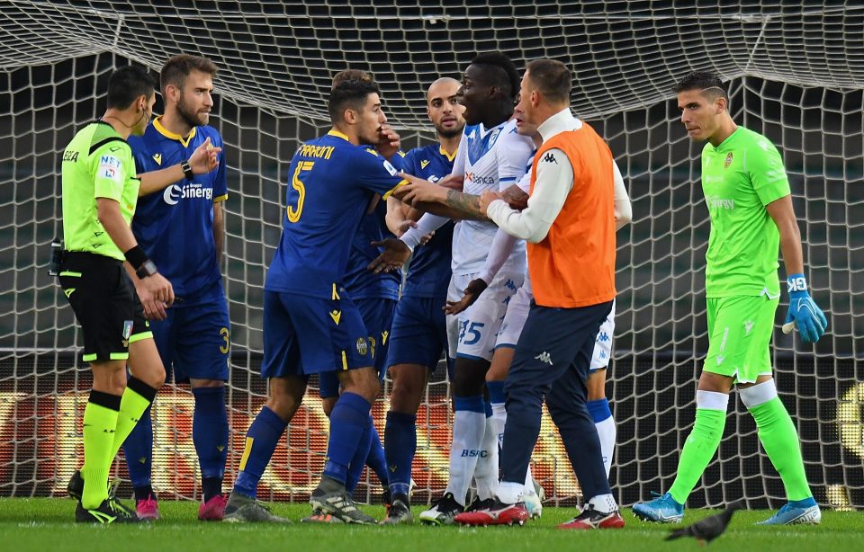  Balotelli was surrounded by opposing players and team-mates after the incident