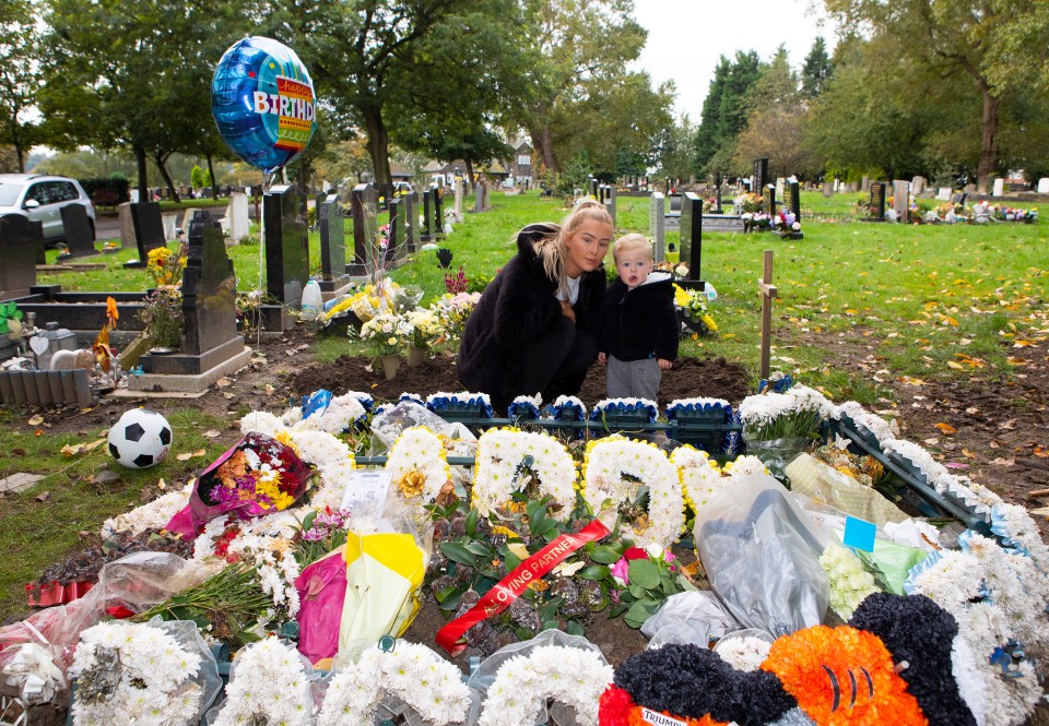  The grave is covered in flowers for the dad