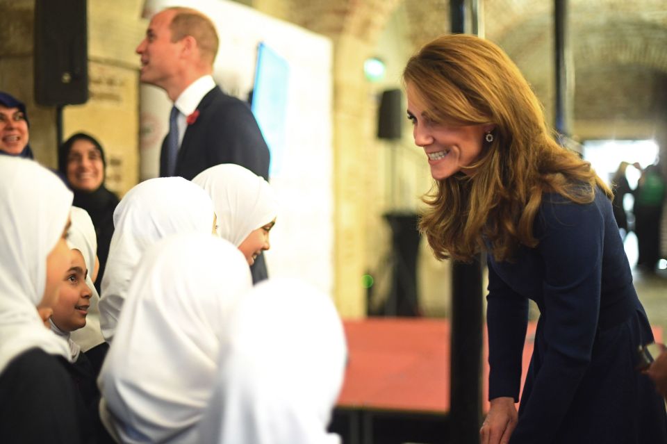 The duchess speaks to a number of young women