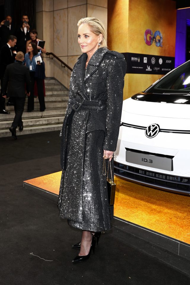  Sharon wore a stylish trench coat as she arrived