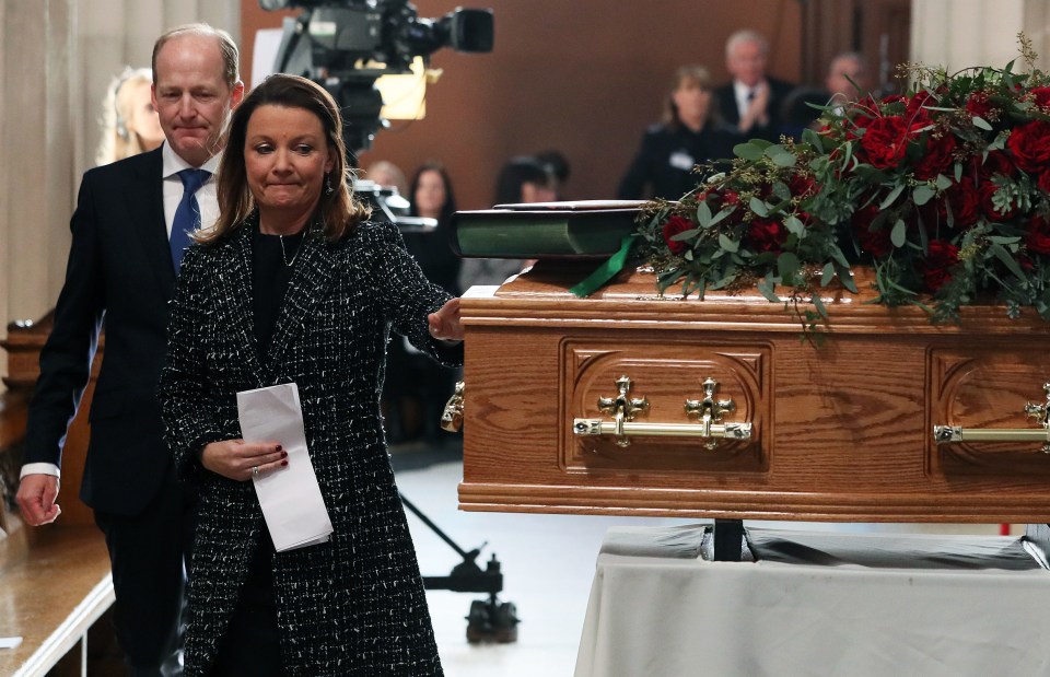 Gay Bryne’s daughter, Suzy O’Byrne, touches her dad’s coffin at St Mary’s Pro Cathedral today