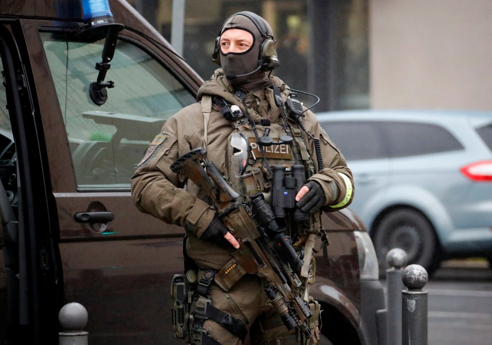  Masked special forces cops pictured in the city today ahead of the anniversary events