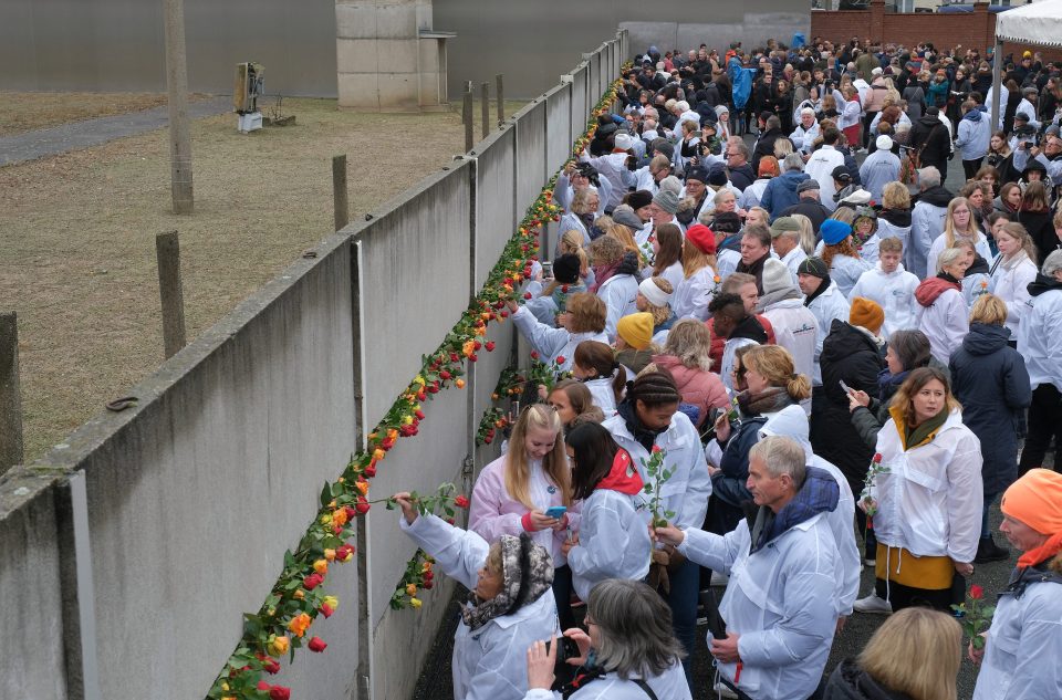  Berliners gather in the rain to mark the historic event which saw Germany united as one