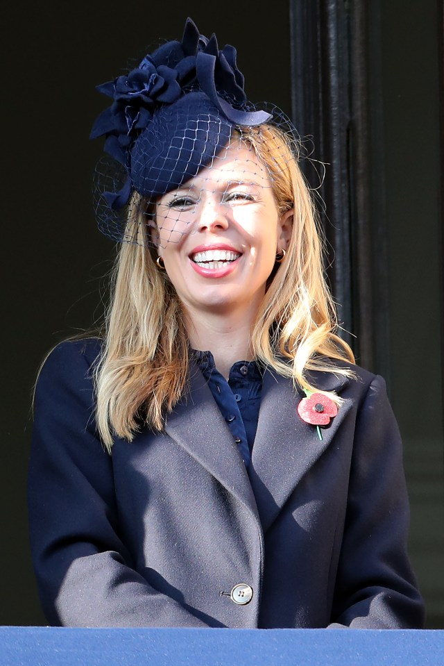  Ms Symonds watches the service from a balcony