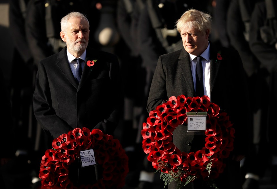  Boris Johnson and Jeremy Corbyn carry wreaths of poppies at the service