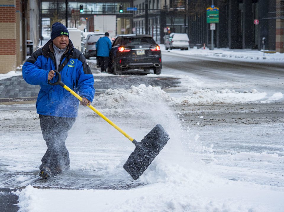  A man shovels snow in Iowa