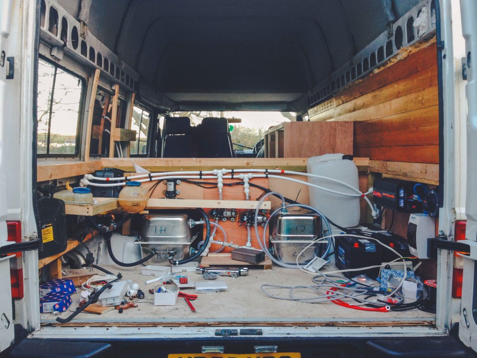  The back of the van before the makeover - their bed now sits on top of this