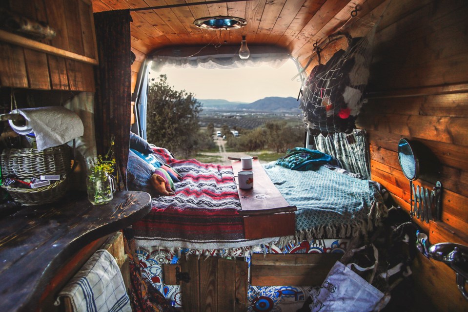  The cosy van stocked with supplies and items they need to live off grid while travelling