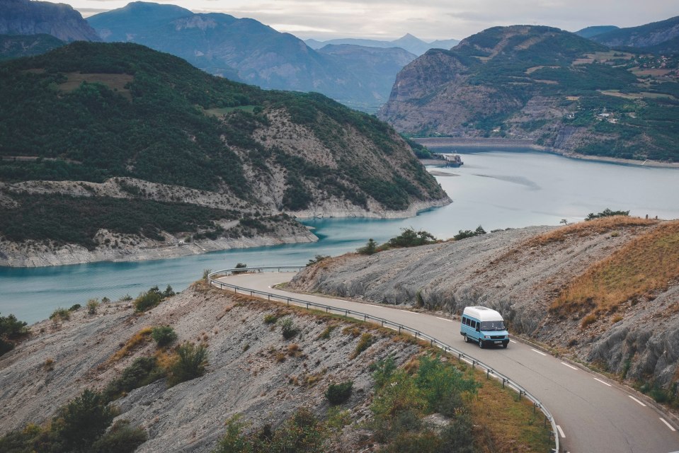  The pair driving the van through the Alps - they have been travelling the world for years