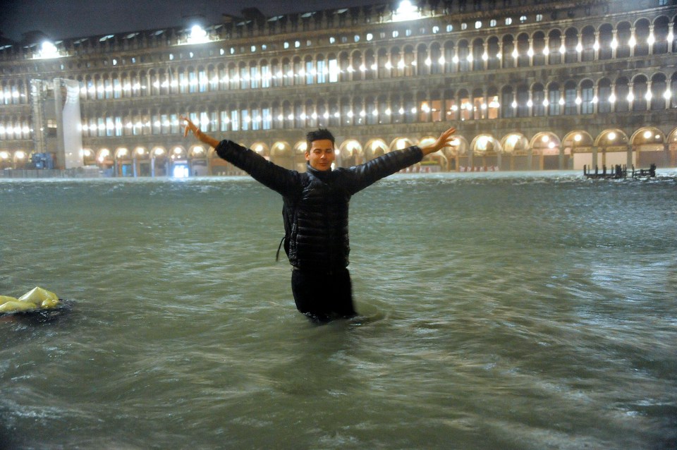  Tourists were forced to wade through the heavy floods