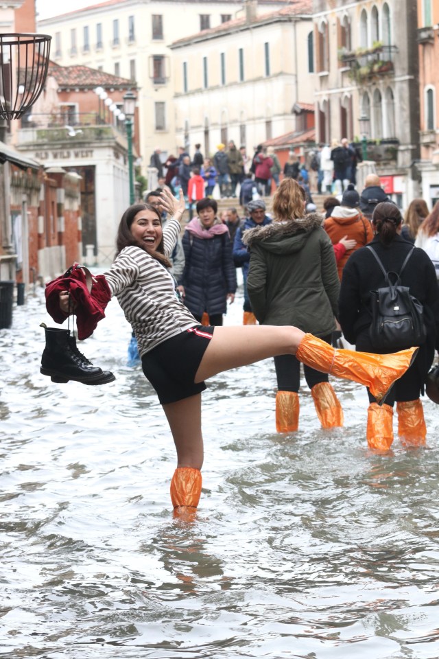  Tourists donned high rubber boots or even hip waders to witness and photograph the spectacle