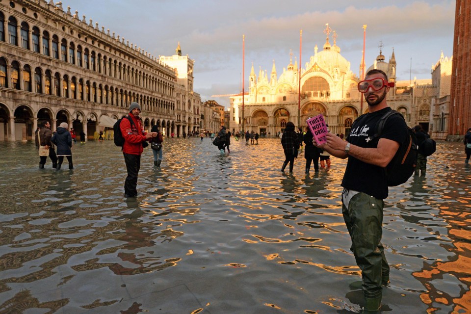  Venice floods 2019: Tourists are seen in flooded St. Mark's Square in Venice