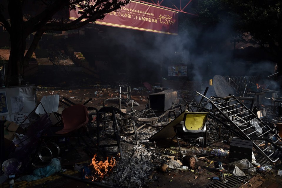 The burnt out shell of the main PolyU entrance after days of clashes