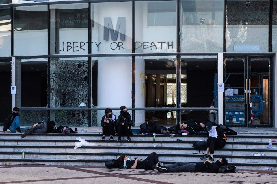  Protesters sit in the campus on the sixth day of protests