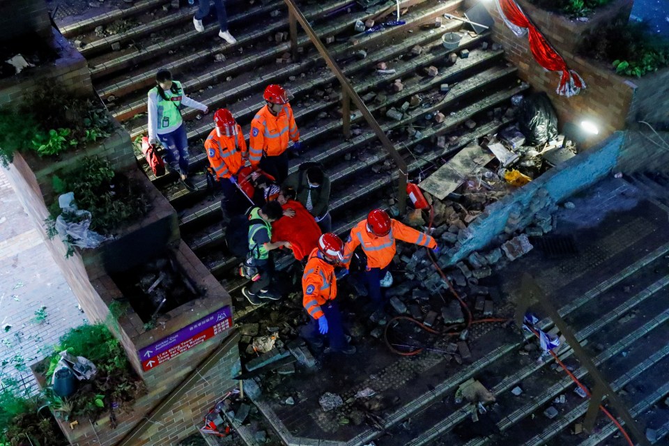 Rescue workers pulled an activist from the burnt-out university building