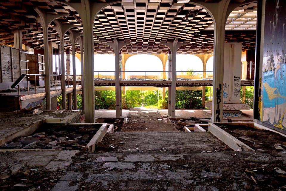  The hotel is now in ruins with broken glass and graffiti throughout