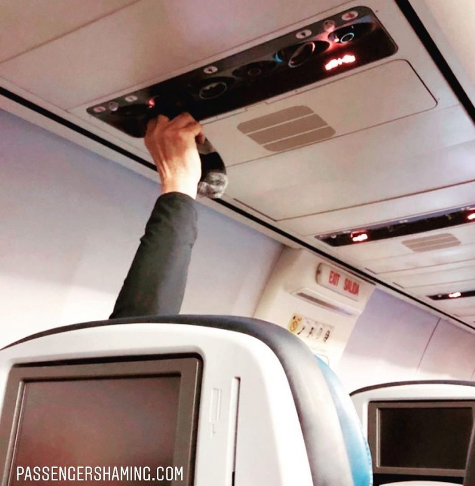  A man was spotted drying his socks using the air vents on a plane