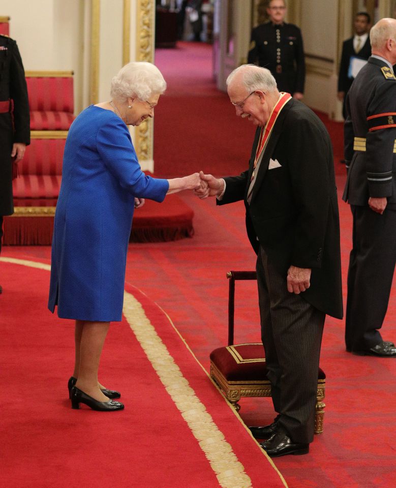  It was business as usual for the Queen at an investiture ceremony at Buckingham Palace