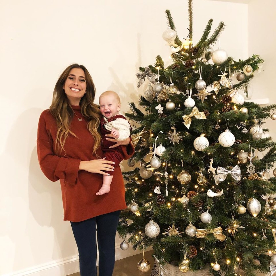  Stacey Solomon and her baby Rex posed in front of the Christmas tree