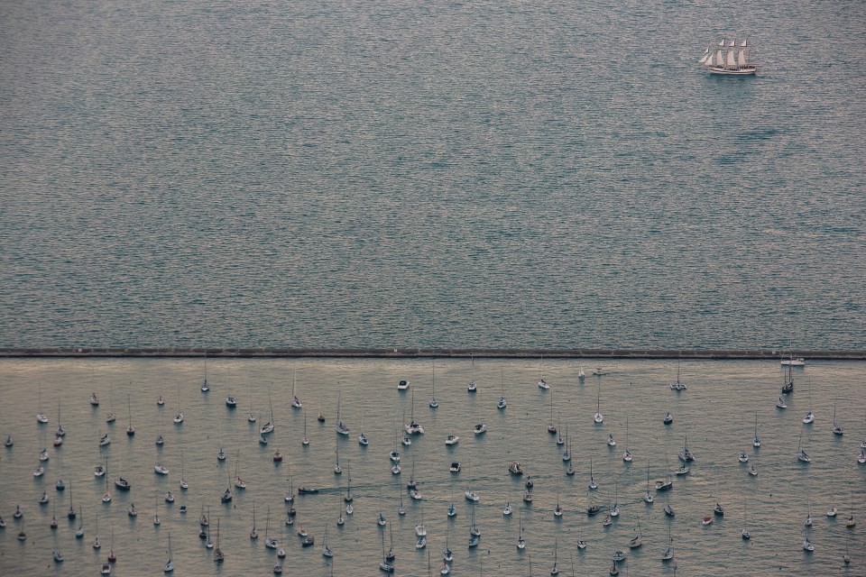  A tall ship passes by the breakwater of Monroe Harbor in downtown Chicago, USA, September, 2013